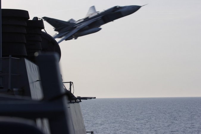 Su-24 flying over USS Donald Cook